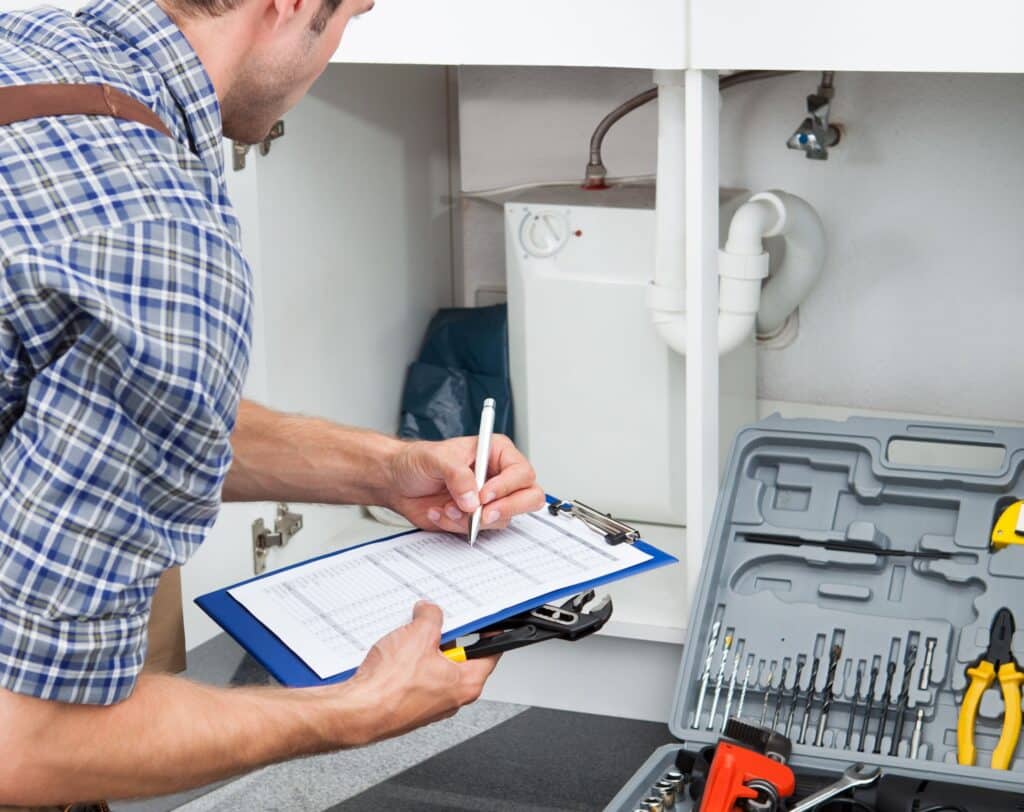 A worker assessing the energy efficiency of a home.